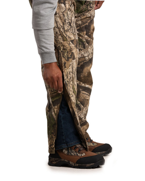Close detail of camouflage insulated duck bib overalls
