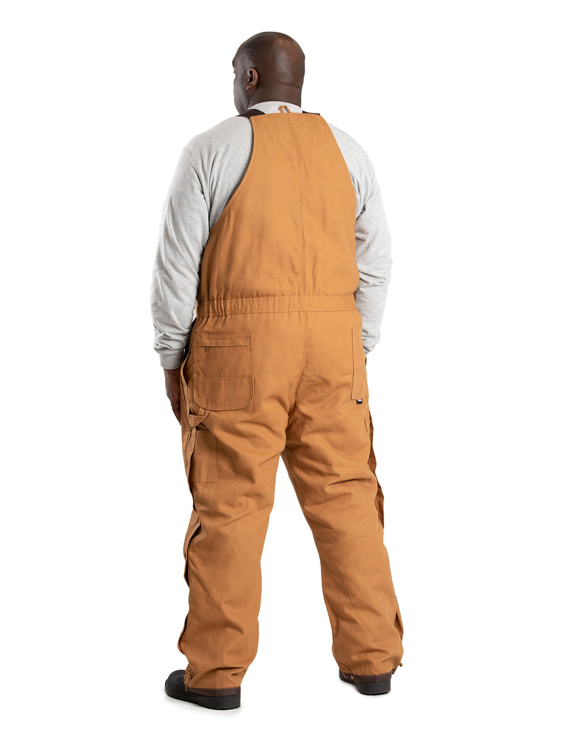 Back view of insulated brown duck bib overalls, alternate shot