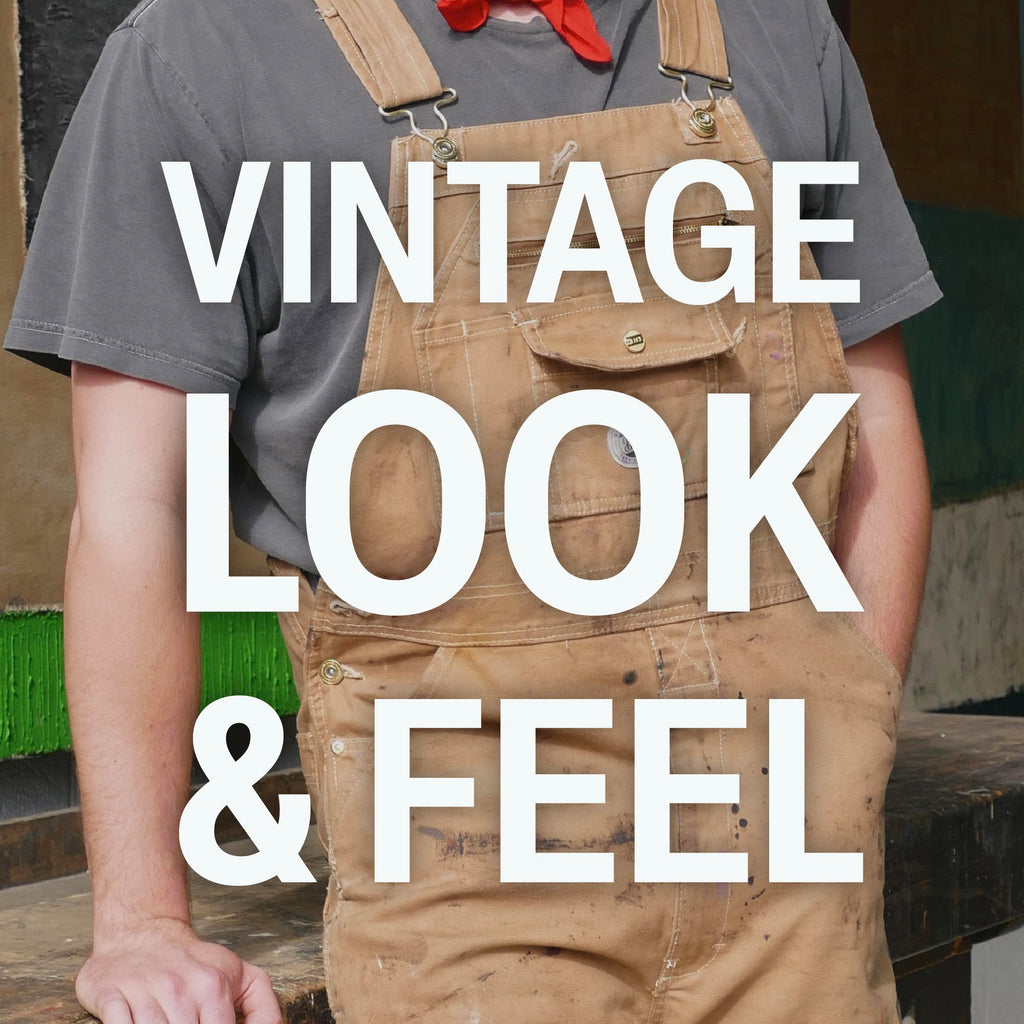 Worn on the job of brown washed duck bib overalls
