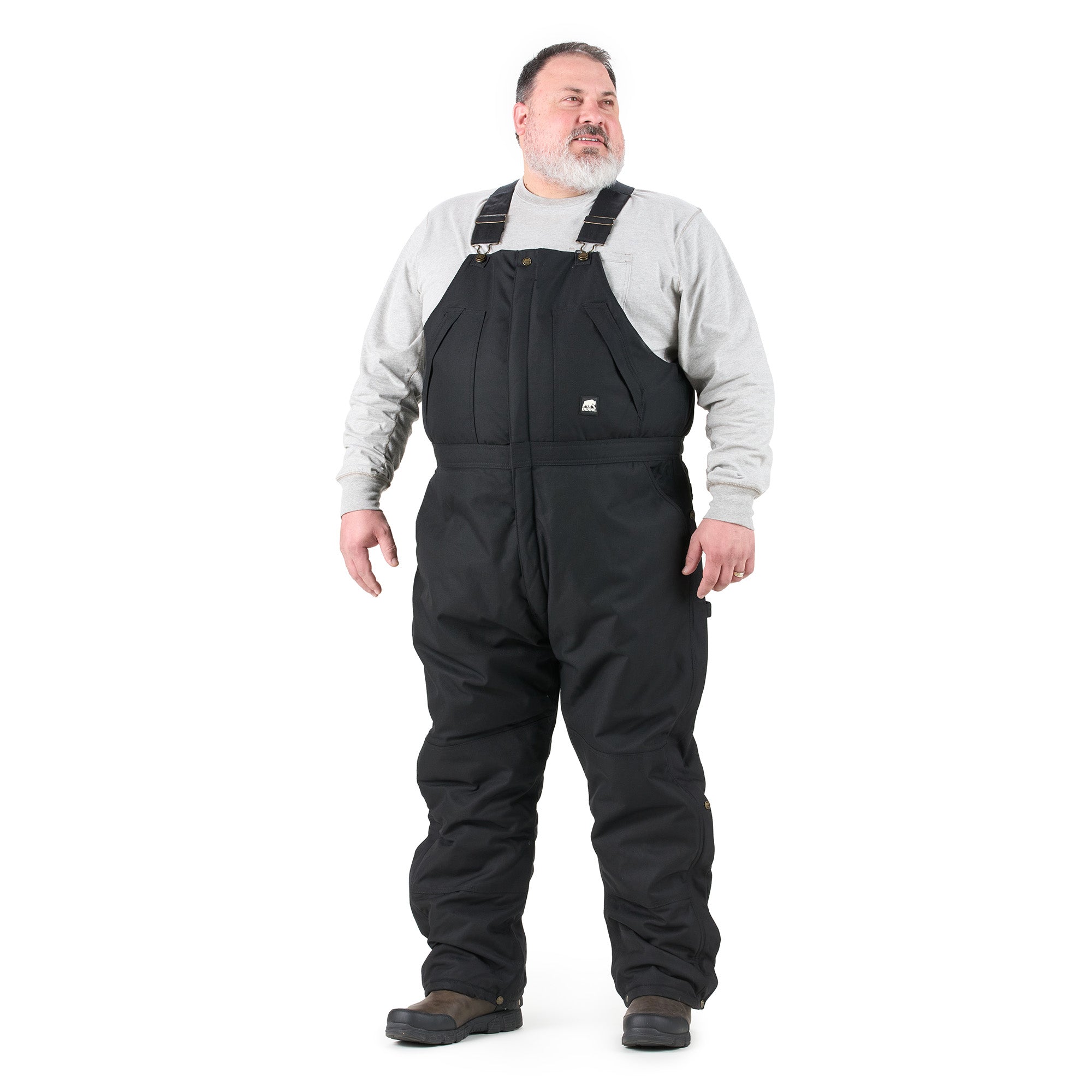 Front view of black insulated bib overalls, alternate shot
